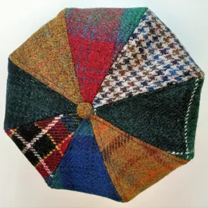 Detailed view of women's autumn winter wool patchwork tweed beret cap with retro British style.