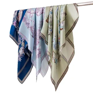Mulberry silk square scarf featuring elegant floral print and luxury style border. Hanging display.