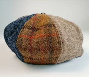 Detail view of women wool patchwork flat cap, colorful tweed panel, autumn winter style.