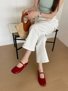 Women's red split-toe Mary Jane flats, comfortable slip-on design for daily wear.