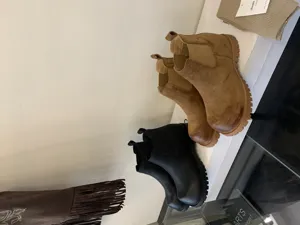 Chunky platform Chelsea boots detail showing premium suede and leather texture, thick lug sole.