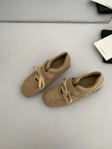 Detailed view of beige suede mesh Mary Jane casual shoes with stylish lace and strap design.