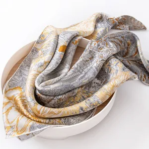 Detailed shot of a luxury silk scarf with intricate botanical print, draped elegantly.