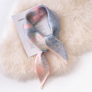Luxury mulberry silk scarf with elegant pink and blue botanical print, soft neck wrap for women.