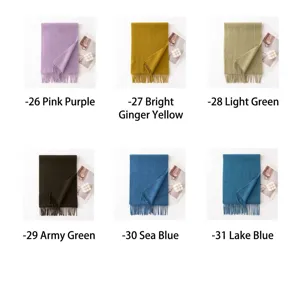 Solid color wool winter scarf detail showing multiple Morandi color options with fringe trim.