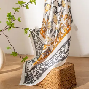 Luxury mulberry silk scarf featuring elegant jungle animal print, perfect as a stylish shawl wrap.