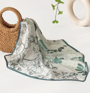 Mulberry silk square scarf featuring elegant lotus floral print and chic green border design.