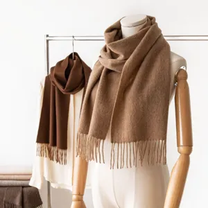 Classic wool winter scarf with fringe displayed on mannequin for women daily warmth.