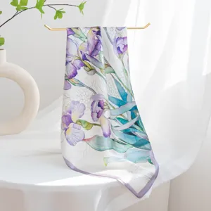 Detailed view of silk square scarf featuring elegant purple floral watercolor print on display.