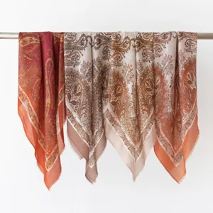 Detailed view of luxury retro paisley cashmere scarf with elegant tassels for autumn.