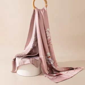 Elegant pink silk scarf with lotus print and wooden ring buckle, perfect for cheongsam.