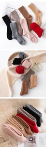Detailed view of thick winter wool ribbed socks, cozy knit warm long socks for women.