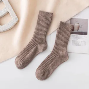 Women's thick wool winter socks, cozy ribbed mid-tube thermal knit socks for cold days.