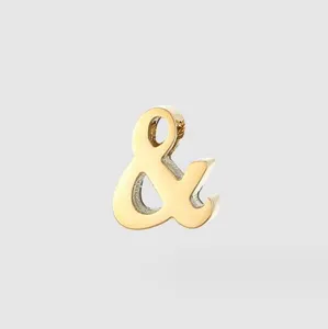 Gold ampersand symbol metal charm detail, DIY jewelry pendant accessory close up view
