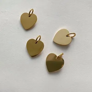 Gold heart pendants crafted from titanium steel, perfect for DIY jewelry and custom engraving.