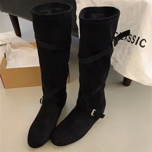 Black suede knee high boots for women with cross straps and buckles, retro western style.