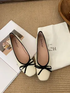 French square toe flat ballet shoes with chic black bow and trim, elegant everyday footwear.