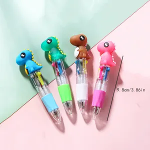 Mini 4-color ballpoint pen with cute cartoon dinosaur topper, compact writing detail view.