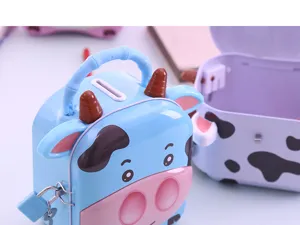 Détail de tirelire mignonne vache dessin animé boîte à monnaie bleue en métal serrure.