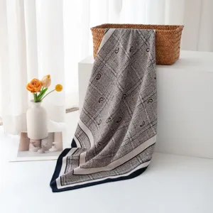 Detailed view of the luxury paisley silk wool square scarf with classic old money style.
