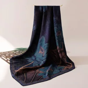Detailed view of the luxury mulberry silk scarf featuring an elegant retro lotus print design.