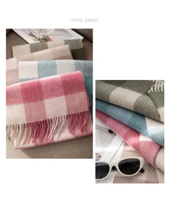 Detailed shot of cozy autumn winter plaid wool scarves with soft fringes and lovely colors.