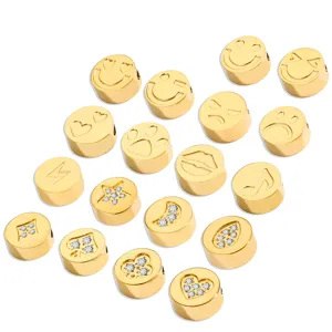 Stainless steel gold DIY charm beads detail shot, featuring cute smiley faces and crystal accents.
