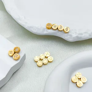 Stainless steel gold charm beads with smiley face, star, and heart patterns for DIY jewelry.