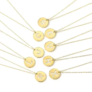 Gold stainless steel initial letter pendant necklace set with white mother of pearl inlay.