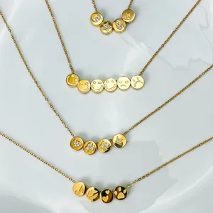 Gold stainless steel multi pendant charm necklaces set with cute symbols and sparkly stones.