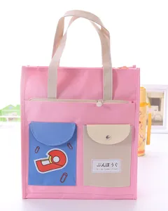 Carina borsa in tela rosa da studente con tasche multiple e comodi manici resistenti.