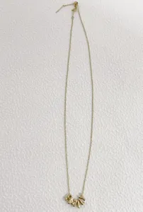 Gold-tone fine chain necklace featuring trendy 3d puffy letter charms for stylish everyday wear.