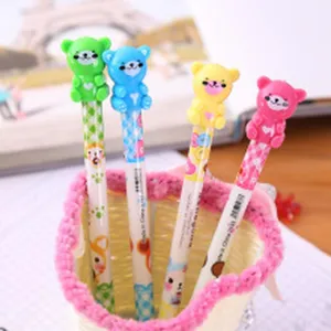 Cute cartoon bear gel pens detail view, colorful patterned barrels in a basket holder.