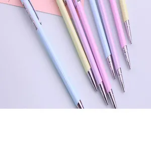 Close-up detail of pastel mechanical pencils in soft blue, pink, and yellow colors.