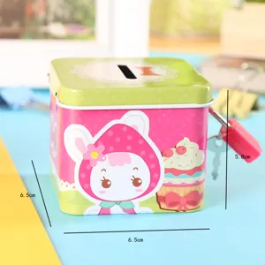 Metal square piggy bank detail shot with lock and key, cute rabbit cartoon design for gifts.