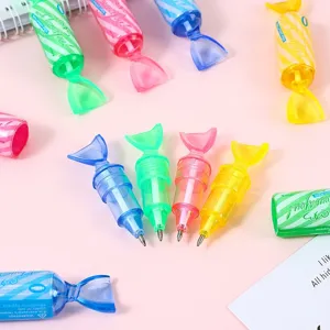 Detailed close-up shot of colorful candy-shaped ballpoint pens in vibrant transparent colors.