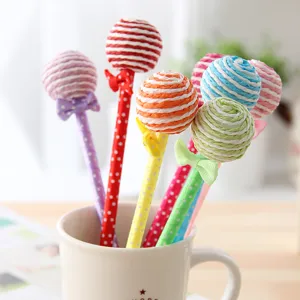 Cute colorful lollipop ballpoint pen detail shot, creative stationery gift for students.
