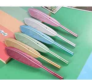 Close-up detail of creative feather-shaped gel pens in multiple vibrant metallic colors.