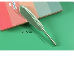 Metal feather gel pen detail shot in green finish, elegant stationery gift item.