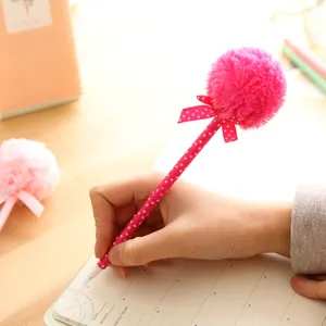 Cute pink fluffy pom pom ballpoint pen with polka dot bow, creative stationery writing pen.