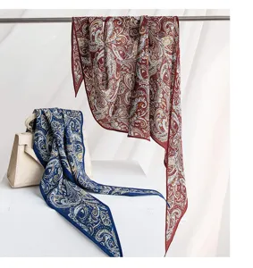 Detailed view of the luxury mulberry silk scarf with classic paisley print, elegant and smooth.