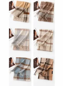 Close-up details of the classic plaid cashmere scarf, soft texture with fringe hem style.