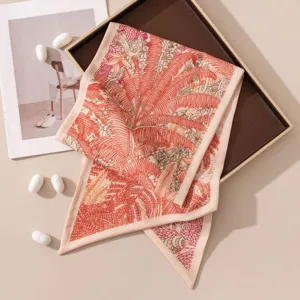 Elegant silk wool scarf with tropical fern print, chic diagonal streamer design for women.