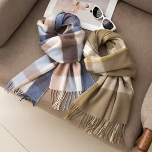 Detailed view of cozy plaid cashmere winter scarves, warm stylish accessories for women and men.