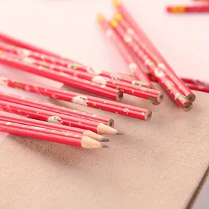 Close-up detail of cute Christmas wooden pencils with festive Santa and snowflake patterns.