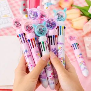 Close up of colorful 10-in-1 unicorn ballpoint pens with glitter floating caps and cute design.