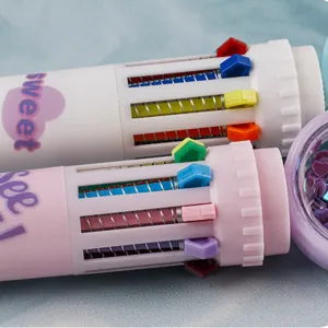 Multi-color press ballpoint pen detail showcasing spring mechanism and sliding color selectors.