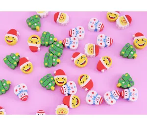Close-up details of assorted cute Christmas cartoon erasers featuring trees and snowmen.