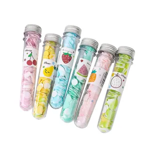 Portable travel disposable soap paper flakes in tube bottle, colorful hand washing sheets.