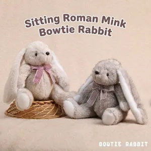Adorable lapin en peluche aux oreilles tombantes avec nœud papillon, poupée douce.